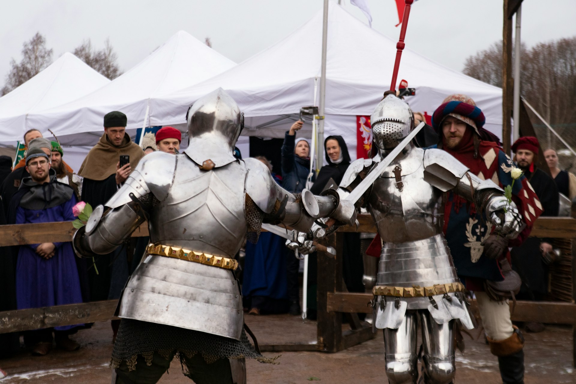 A couple of men in armor standing next to each other